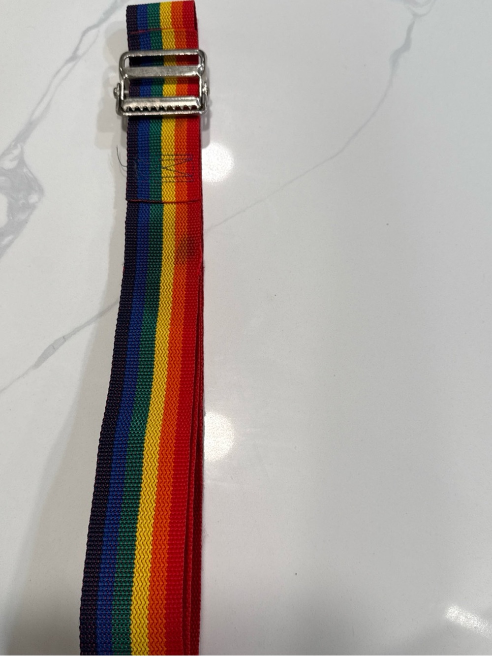 The vintage rainbow belt or strap is a colorful accessory made of nylon,